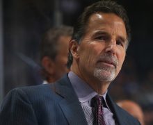 NEW YORK, NY - JANUARY 12: John Tortorella of the Columbus Blue Jackets looks on from the bench against the New York Islanders at the Barclays Center on January 12, 2016 in Brooklyn borough of New York City.  (Photo by Mike Stobe/NHLI via Getty Images)